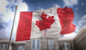 canada-flag-3d-rendering-on-blue-sky-building-background_1379-1255