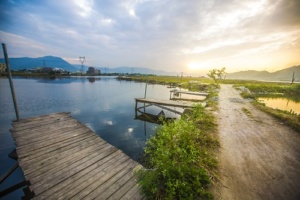 Lovely image of late sunset sky over calm lake landscape with lo